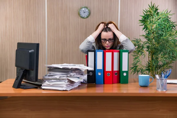 Businesswoman under stress working in the office
