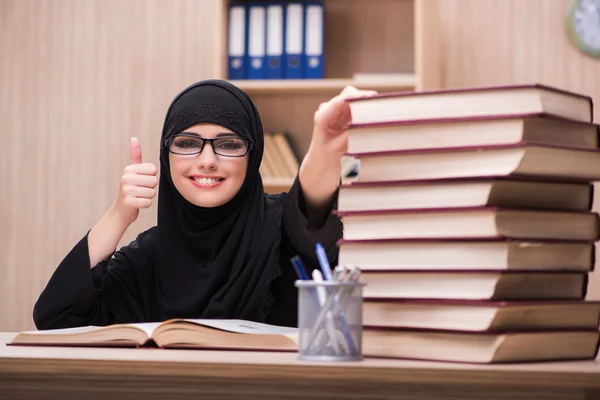 Woman muslim student preparing for exams