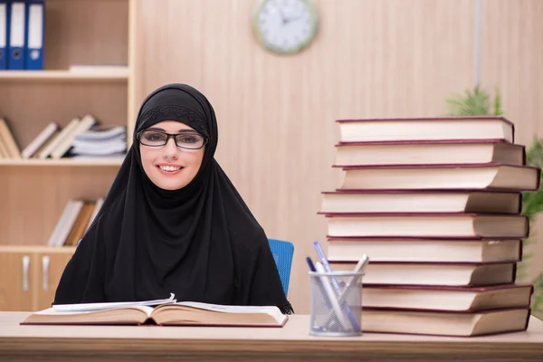 Woman muslim student preparing for exams