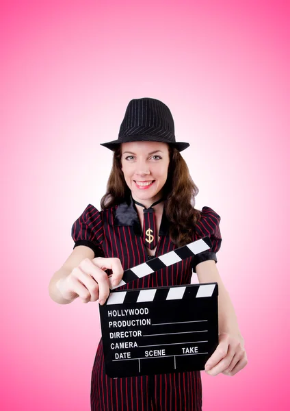 Woman gangster with movie board