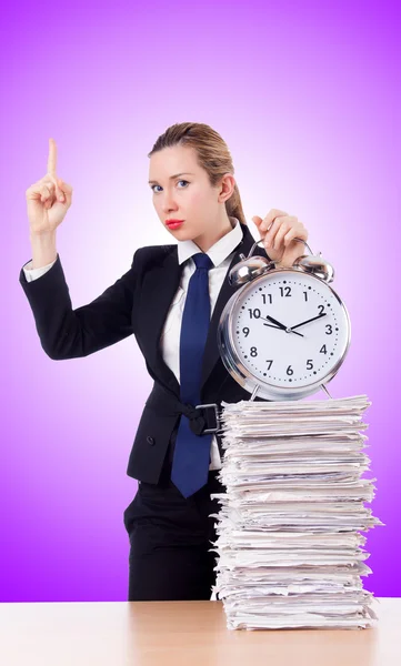 Woman businesswoman with clock and papers