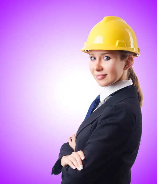 Young businesswoman with hard hat