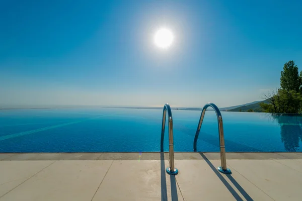 Infinity pool on the bright summer day