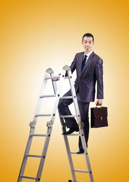 Businessman climbing career ladder against gradient