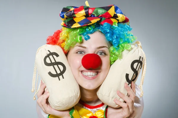 Clown with money bag in funny concept