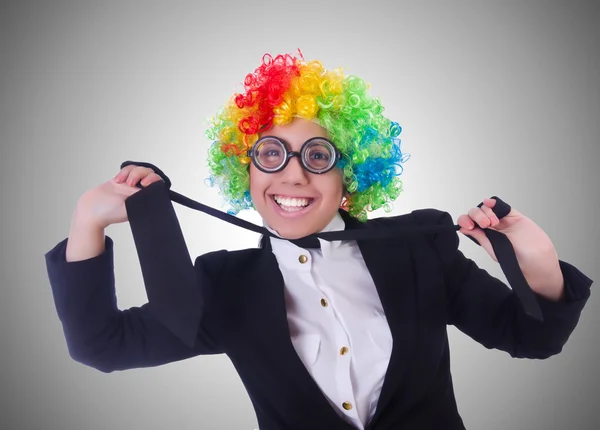 Woman clown businesswoman isolated on grey
