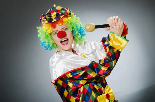 Clown with mic in funny concept