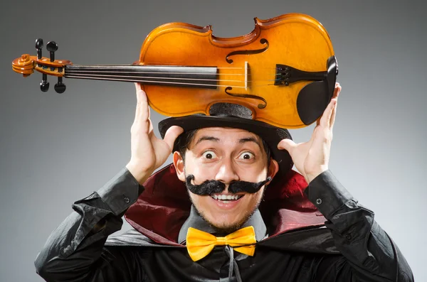 Funny violin player wearing tophat