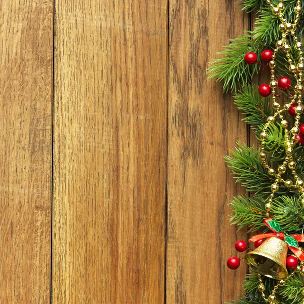 Decorated Christmas tree border on wood paneling