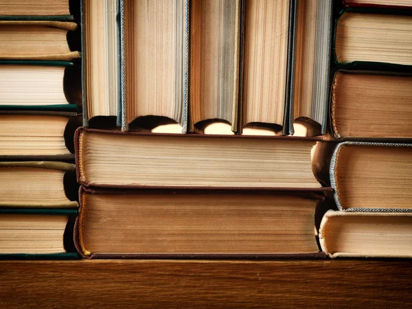 Background made of old books arranged in stacks