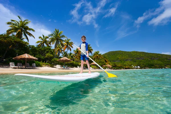 Little boy on stand up paddle board