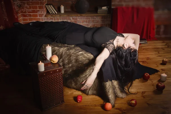 Woman with poisoned apple lies in a tomb