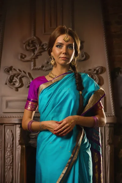 Beautiful young woman in traditional indian clothing