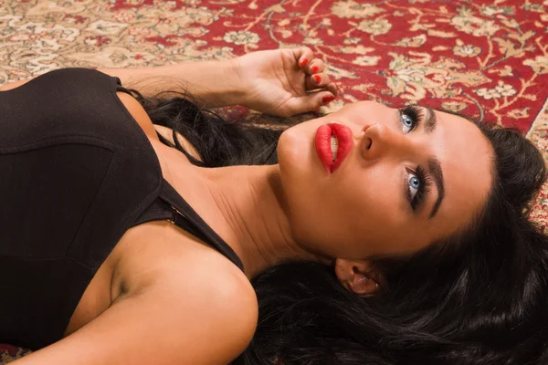 Sensual unconscious woman lying on the floor