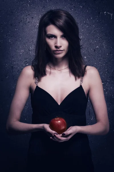 Lonely mad woman with red apple