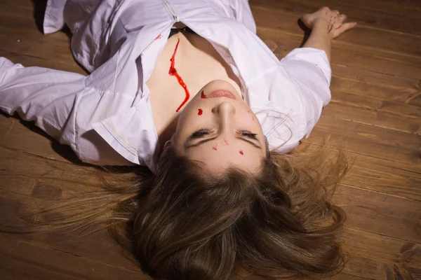 Dead nurse lying on the floor