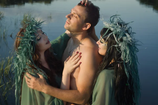 Love between men and two beautiful mermaids