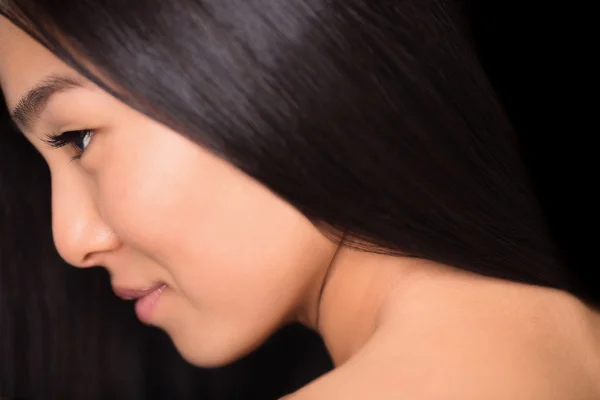 Close-up profile of asian lady in studio