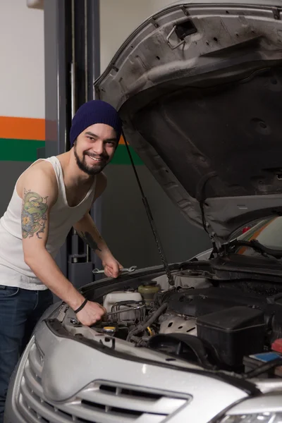 Worker at service station