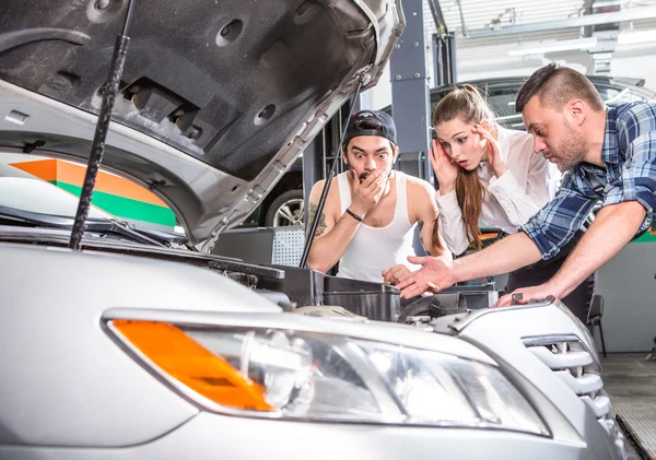 Customer woman looking into engine or motor