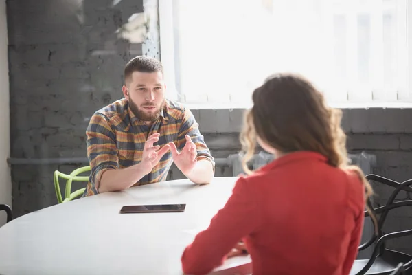 Business meeting of man and woman in office