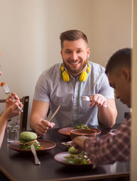 Happy friends in vegan restaurant