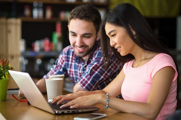 Freelance man and woman working in restaurant