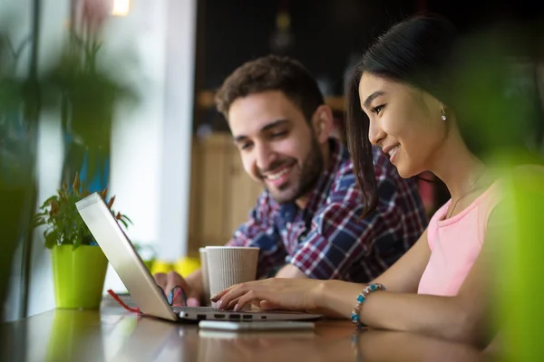 Freelance man and woman working in restaurant