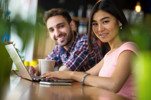 Freelance man and woman working in restaurant