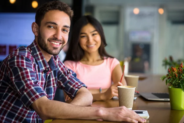 Freelance man and woman working in restaurant