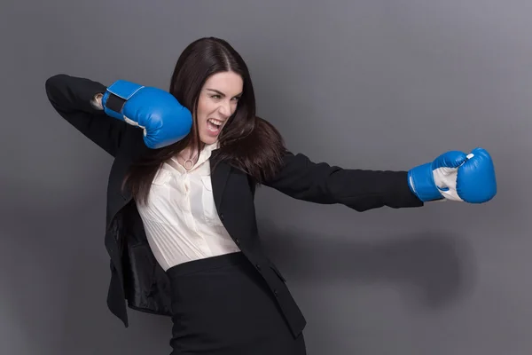 Business lady in boxing gloves