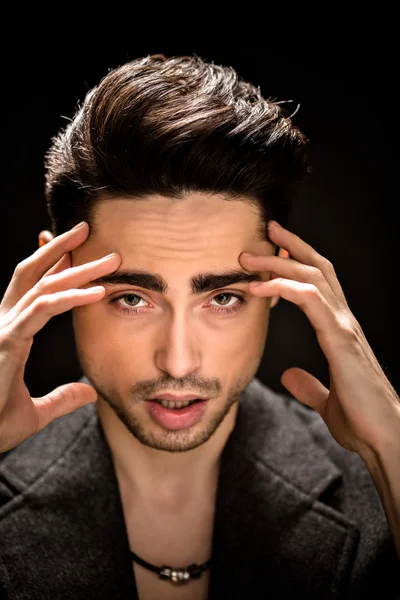 Portrait of model man face in studio