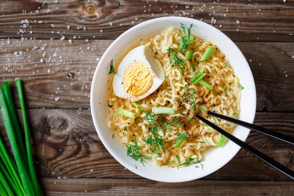 Asian noodles with fresh green onion and boiled egg