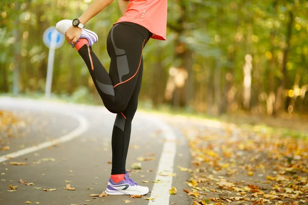 Detail of woman stretching legs