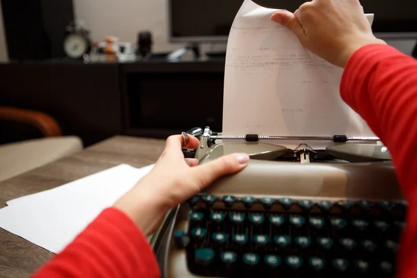 Woman working on typewriter