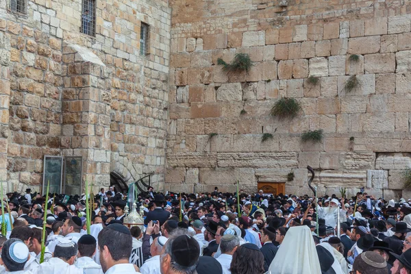 Jewish worshipers in white shawls