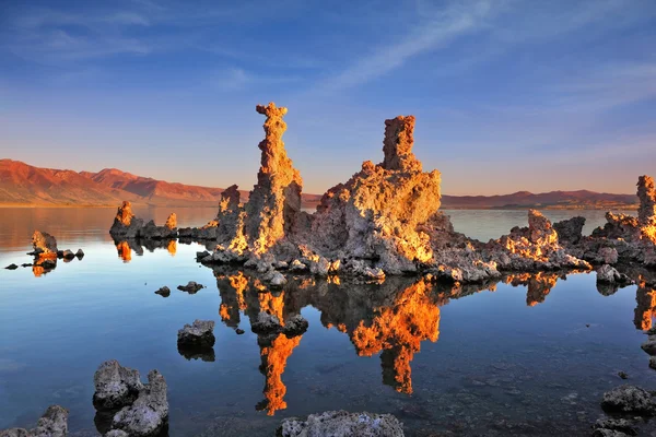 Bizarre limestone formation on smooth water