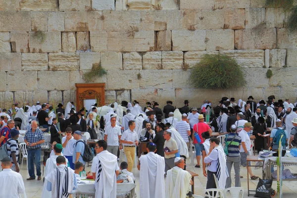 Religious Jews in white prayer shawls