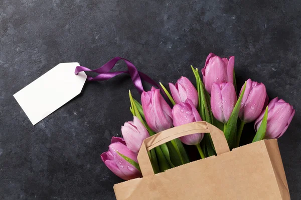 Fresh purple tulips bag