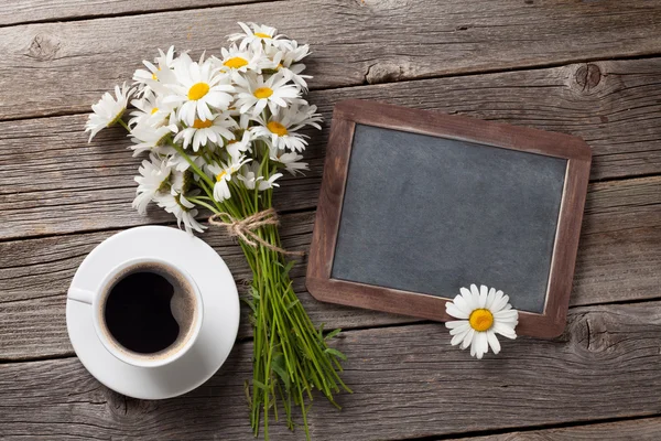 Blackboard, flowers and coffee cup