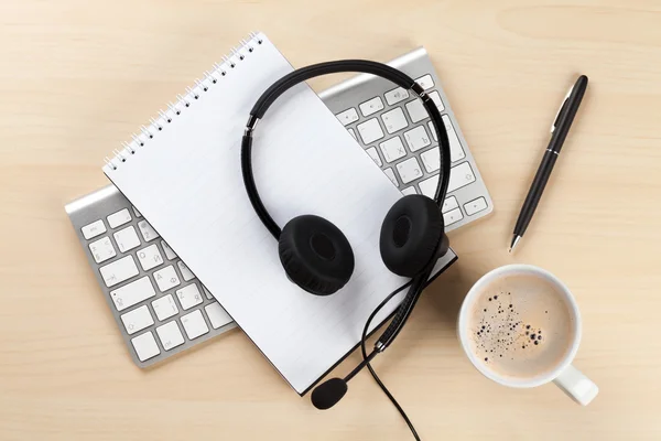 Office desk with headset and pc