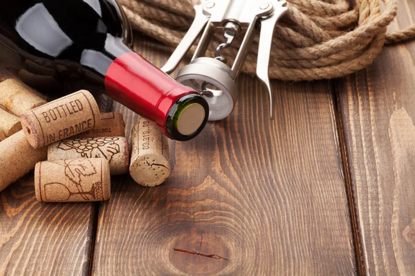 Wine bottle with corks and corkscrew