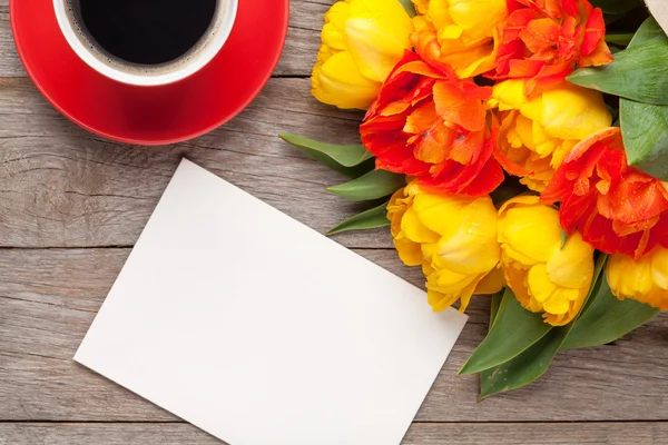 Tulips, greeting card and coffee cup