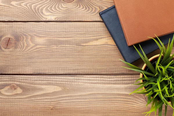 Office desk table, flower and notepad