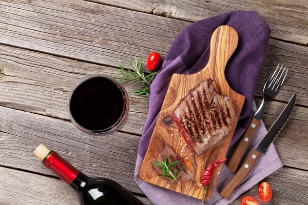 Grilled beef steak with rosemary and wine