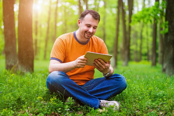 Man with tablet in the park