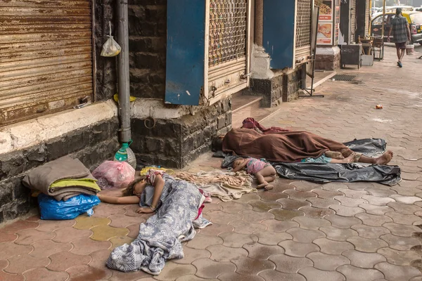 Unidentified poor people sleep at street
