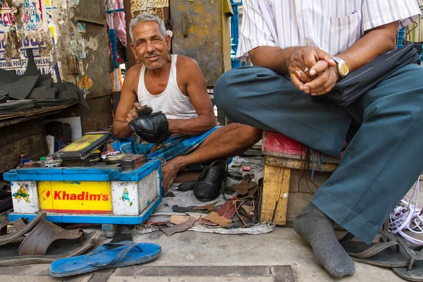 Shoe shiner in Kolkata, India
