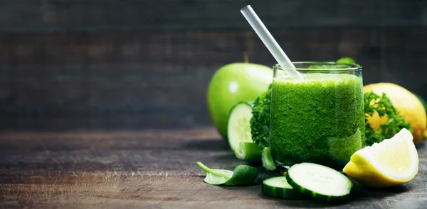 Fresh organic green smoothie - detox, diet and healthy food conc