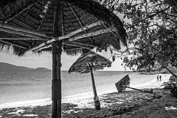 Islands in Southeast Asia. Old beach umbrella from straw.